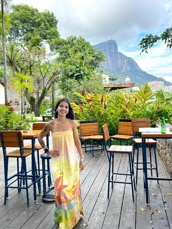 Anne Caroline at a terrace overlooking Pedra da Gávea in Rio de Janeiro